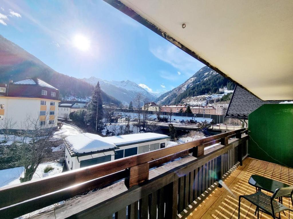 a balcony with a view of a snowy mountain at Bergblick Appartements in Bad Gastein