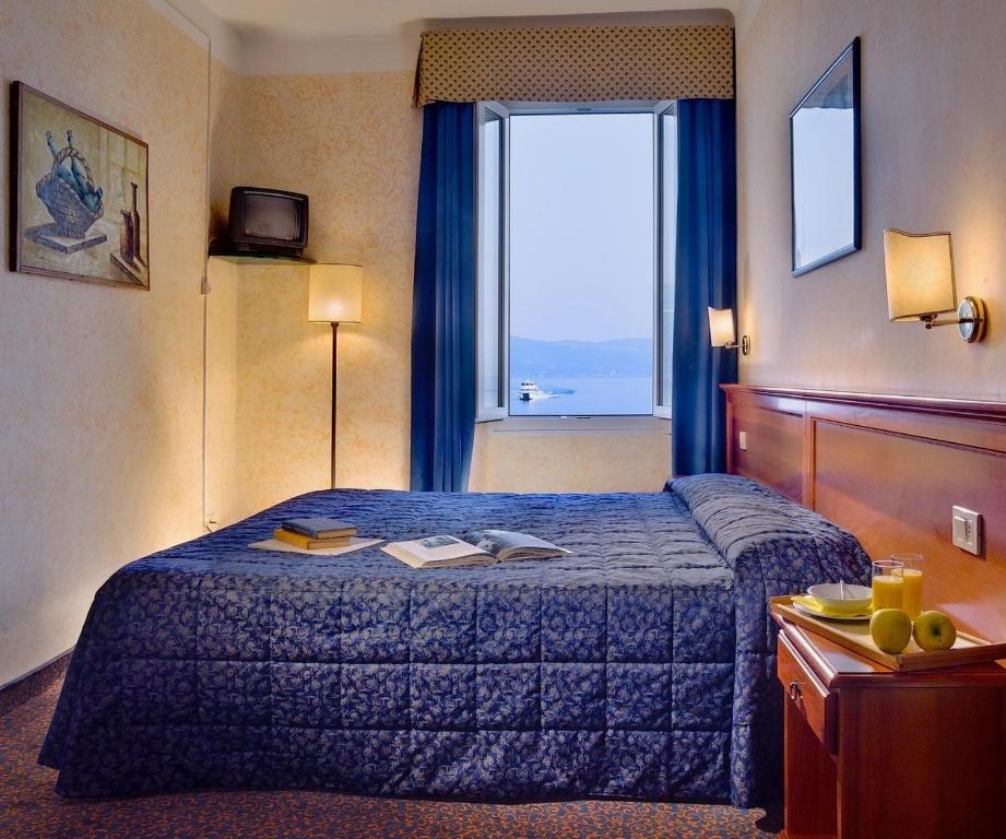 Postel nebo postele na pokoji v ubytování Hotel Garnì Riviera
