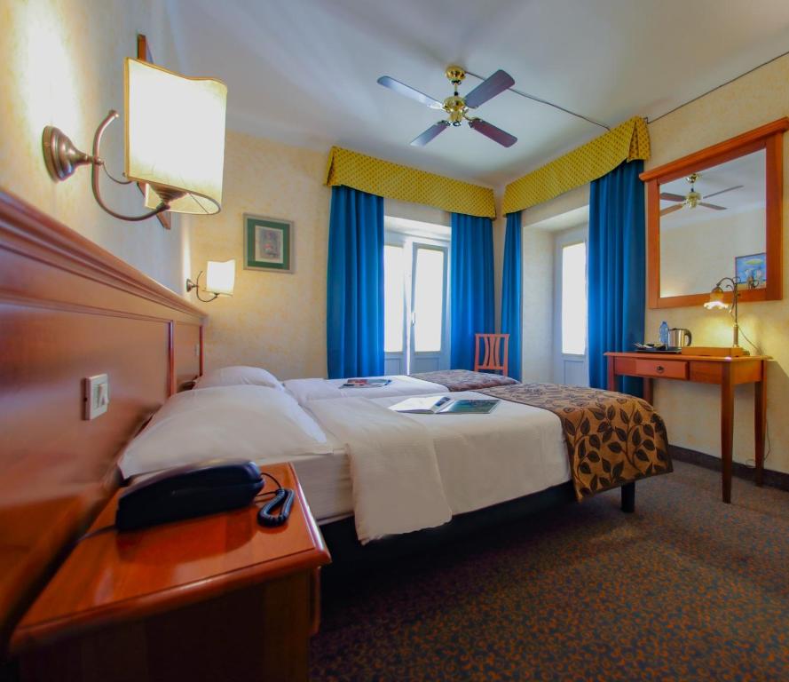 Postel nebo postele na pokoji v ubytování Hotel Garnì Riviera