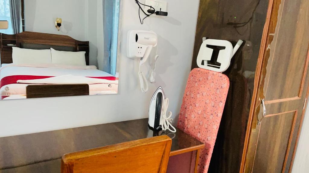 Postel nebo postele na pokoji v ubytování Hotel Nepal Inn Sauraha