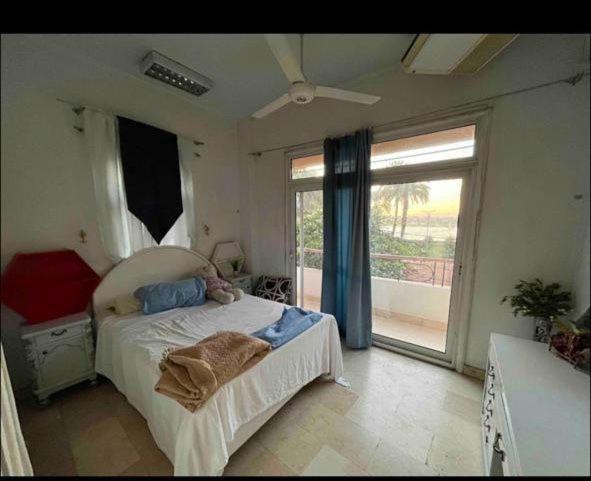 A bed or beds in a room at East Luxor Apartments with Nile views