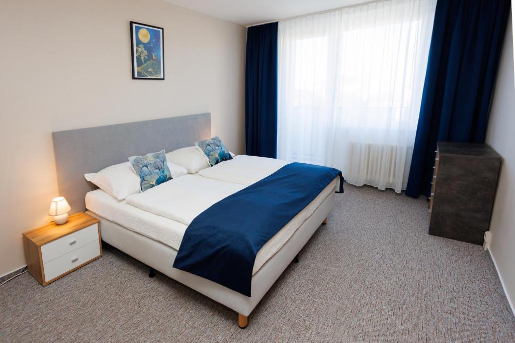 Postel nebo postele na pokoji v ubytování Hotel FIT
