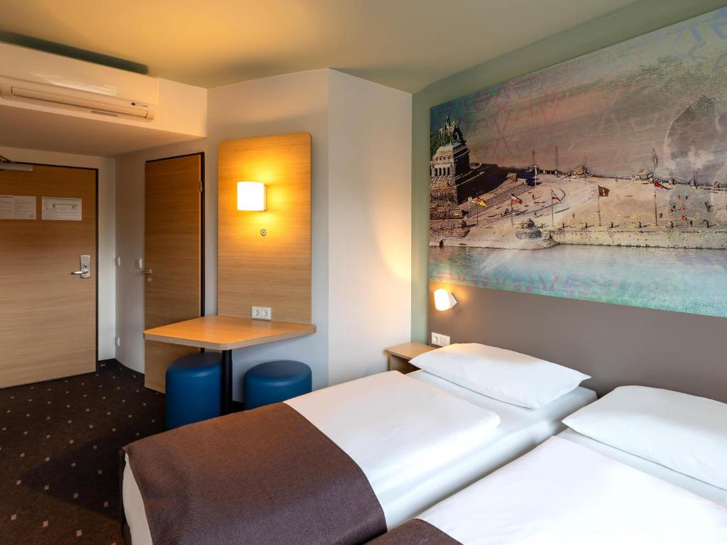 Postel nebo postele na pokoji v ubytování B&B Hotel Koblenz-City