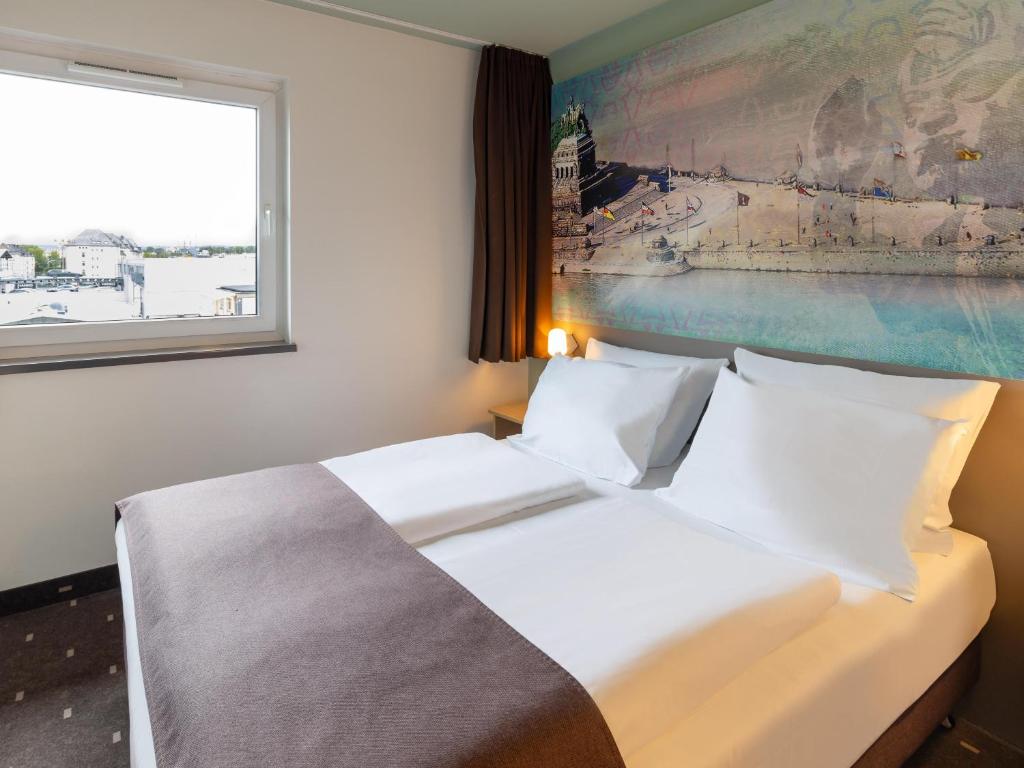 Postel nebo postele na pokoji v ubytování B&B Hotel Koblenz-City