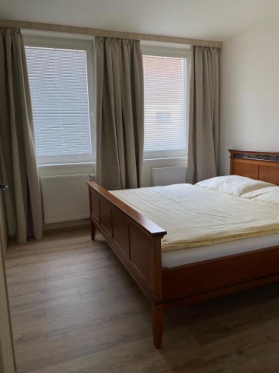Postel nebo postele na pokoji v ubytování Selský Dvůr Perštejn