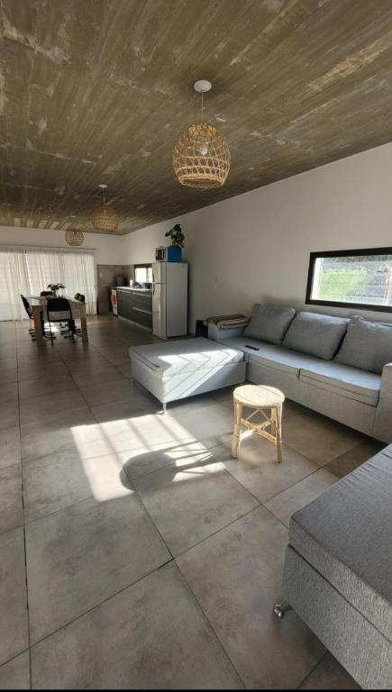 a living room with a couch and a table at Casa Buda in Almafuerte