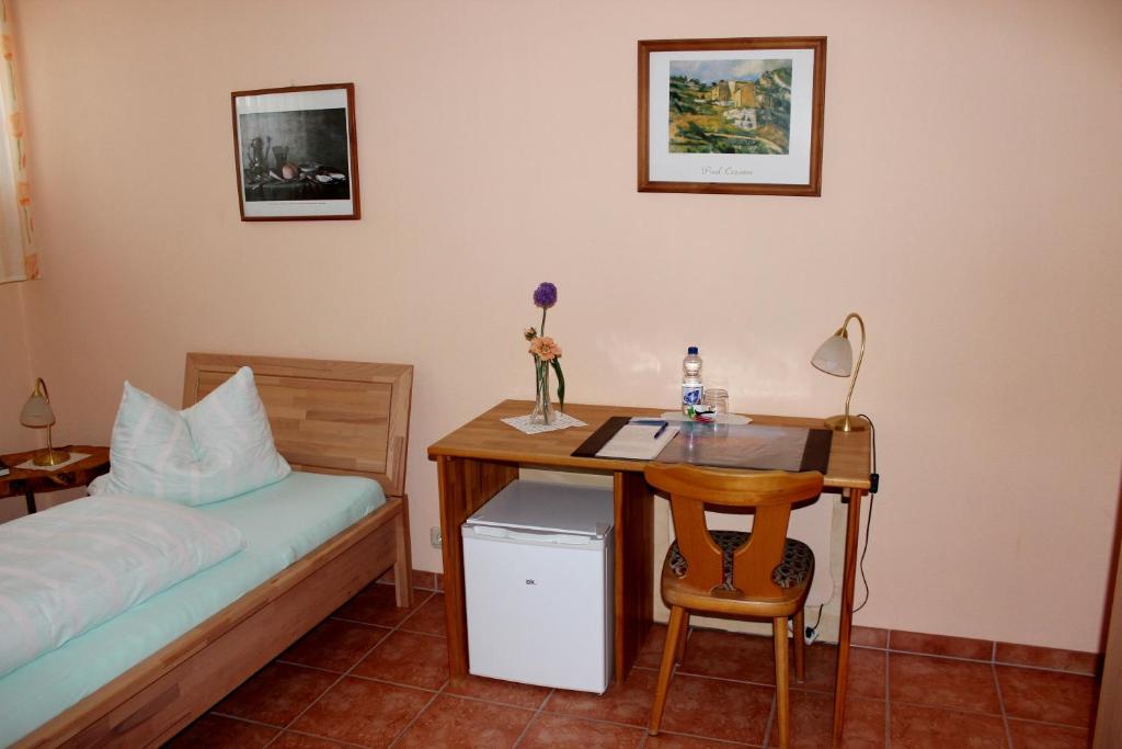 Postel nebo postele na pokoji v ubytování Pfaelzer Stuben