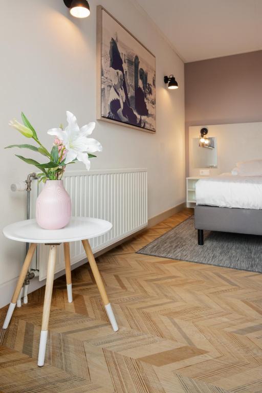 Postel nebo postele na pokoji v ubytování Hotel In den Brouwery