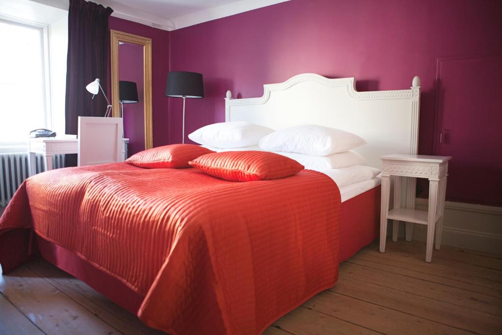 Postel nebo postele na pokoji v ubytování Hotel Hellstens Malmgård