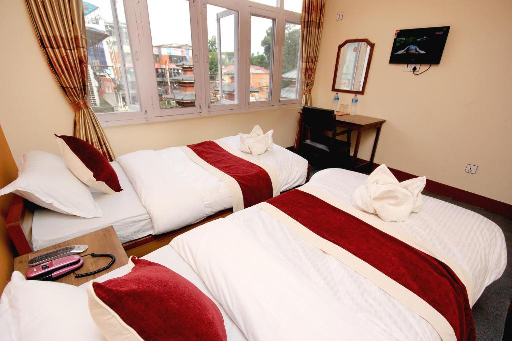 Postel nebo postele na pokoji v ubytování hotel Backpackers inn