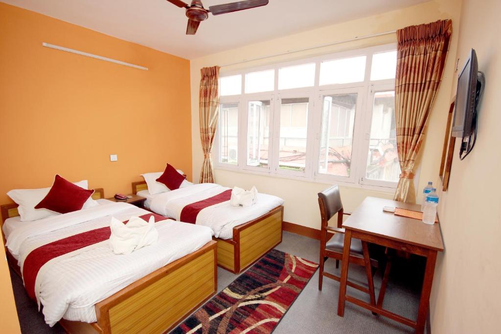 Postel nebo postele na pokoji v ubytování hotel Backpackers inn