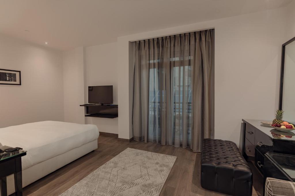 Postel nebo postele na pokoji v ubytování Riverside Hotel