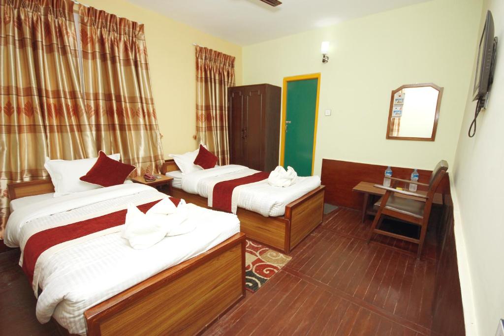 Postel nebo postele na pokoji v ubytování hotel Backpackers inn
