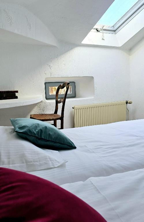 Letto o letti in una camera di Hôtel Candide