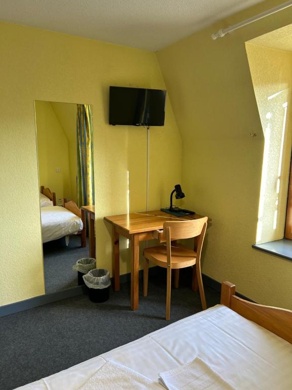 Postel nebo postele na pokoji v ubytování AUX GLOBE-TROTTERS