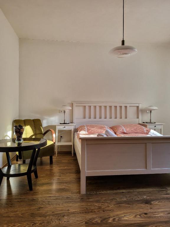 Postel nebo postele na pokoji v ubytování Apartmány Červený Dvůr