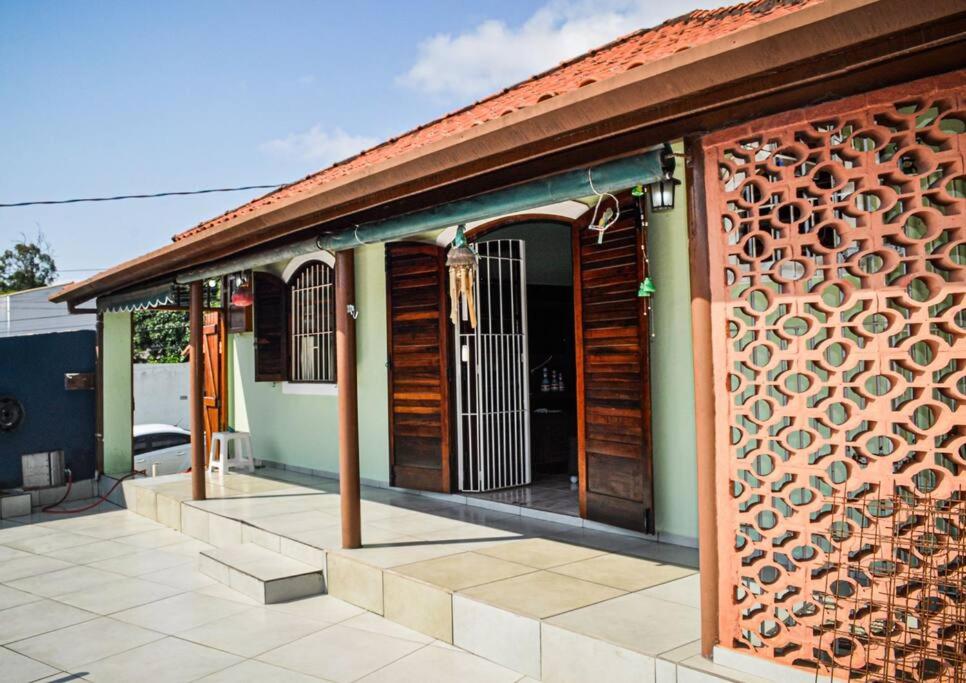 a building with a wall with a gate on it at Casa 46 in São Sebastião