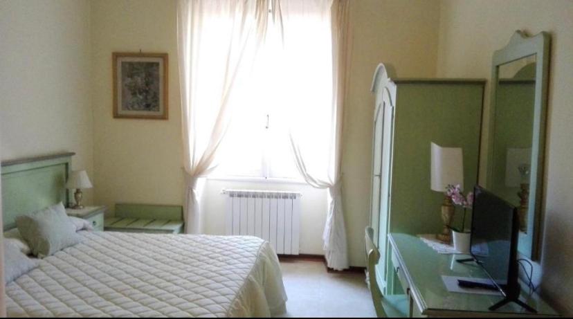 Postel nebo postele na pokoji v ubytování Villa Orsini