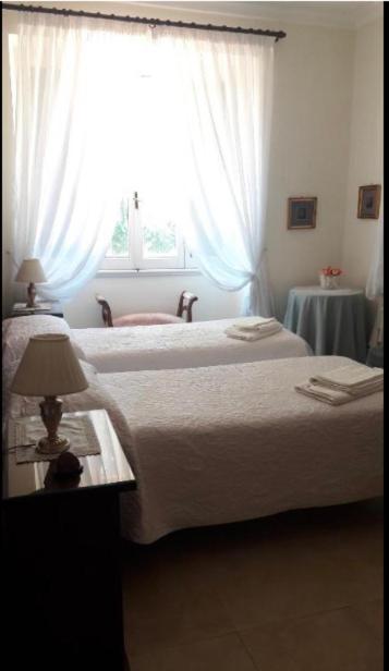 Postel nebo postele na pokoji v ubytování Villa Orsini