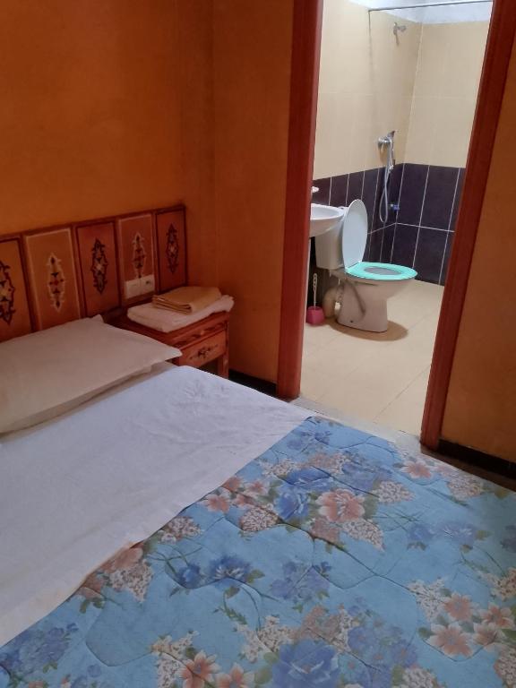 Postel nebo postele na pokoji v ubytování Hotel Des voyageur