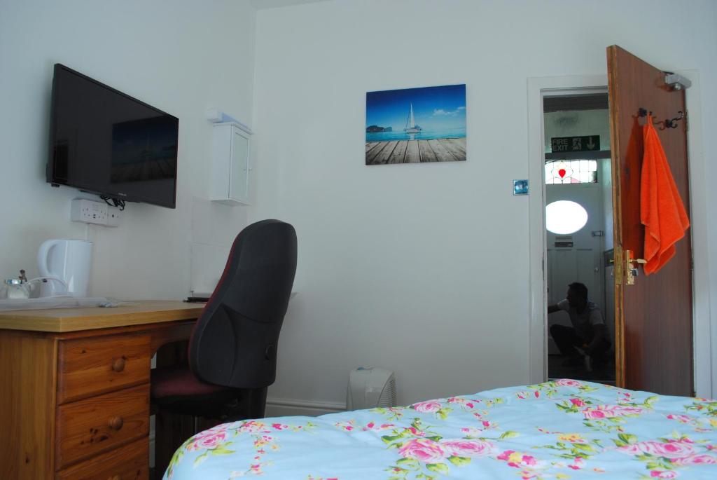 Postel nebo postele na pokoji v ubytování Clift Guest House