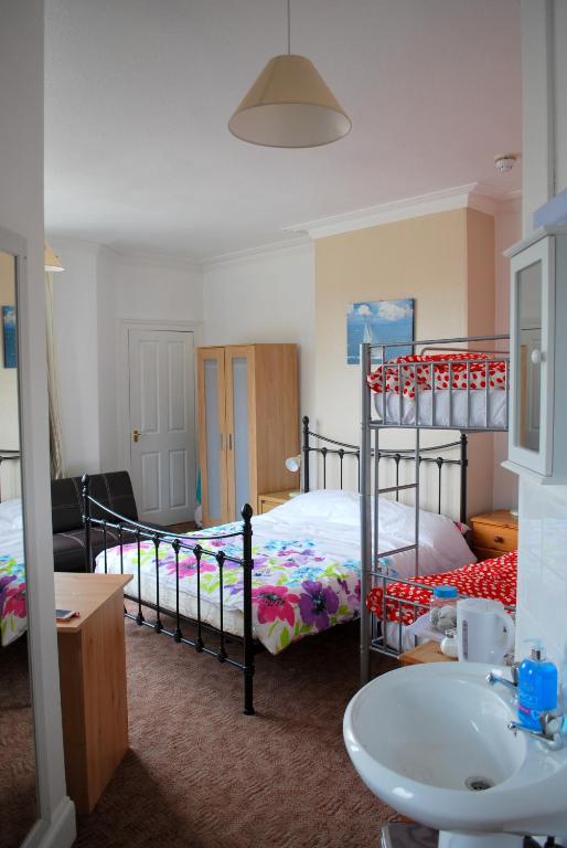 Postel nebo postele na pokoji v ubytování Clift Guest House