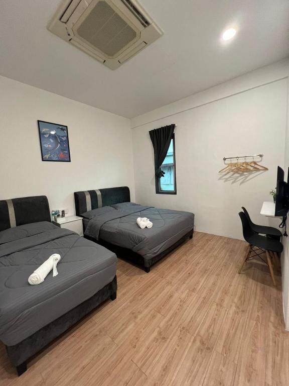 Postel nebo postele na pokoji v ubytování KIWI INN