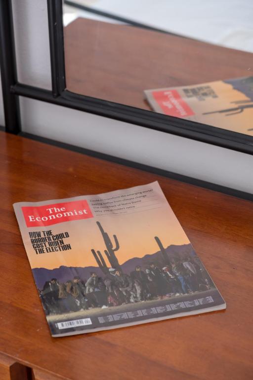 a magazine sitting on top of a table at Billy's House in Samos