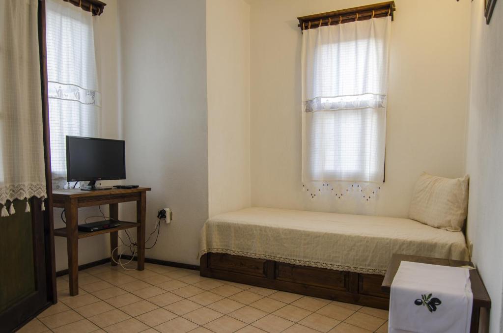 TV a/nebo společenská místnost v ubytování Olive Garden Apart Hotel