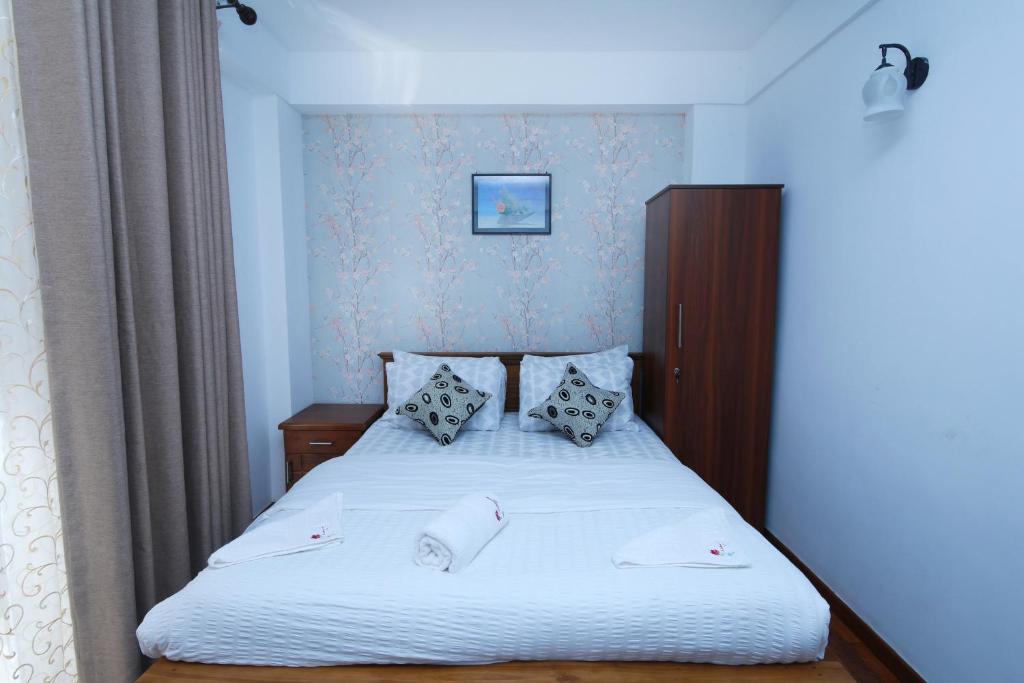 Postel nebo postele na pokoji v ubytování Nelma's Cosy