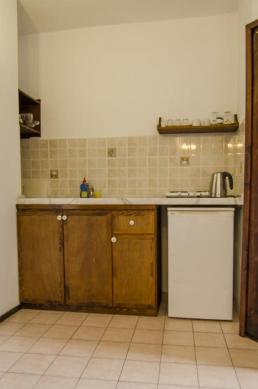 Kuchyň nebo kuchyňský kout v ubytování Olive Garden Apart Hotel