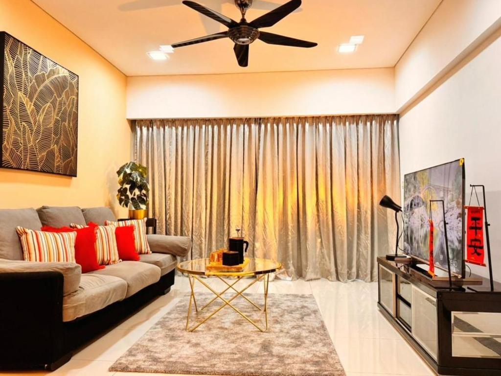a living room with a couch and a ceiling fan at 2BR Summer Suites @KLCC in Kuala Lumpur