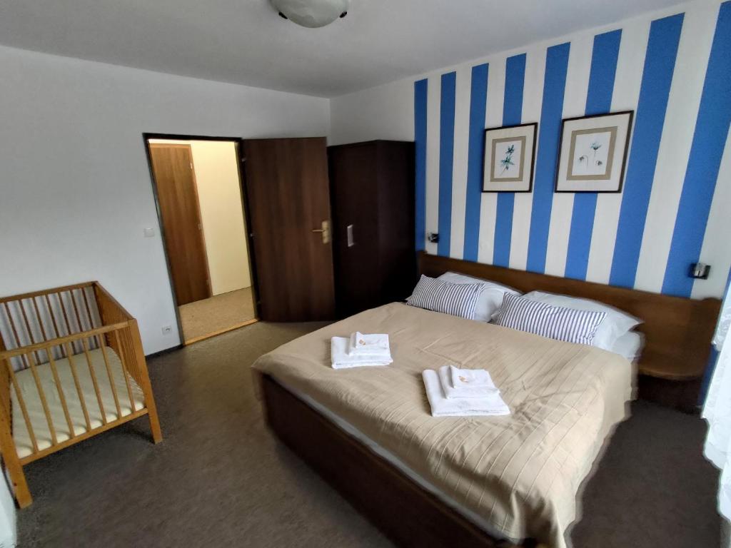 Postel nebo postele na pokoji v ubytování Švihák lázeňský