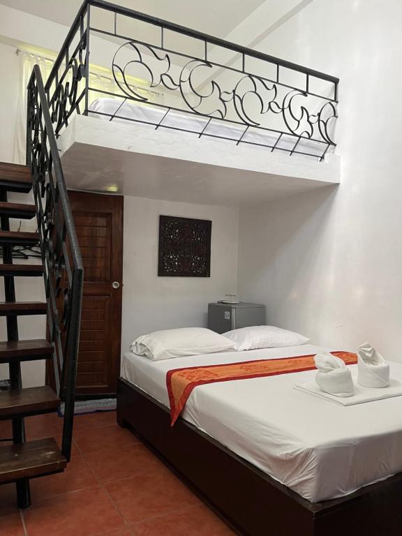 Postel nebo postele na pokoji v ubytování Boracay Ocean Bay Hotel