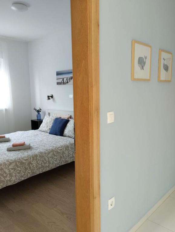 Łóżko lub łóżka w pokoju w obiekcie Apartment Ivetka