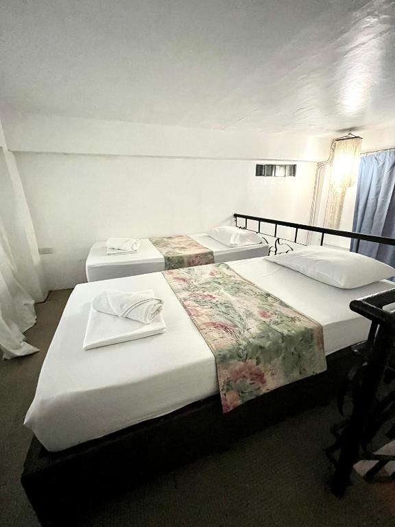 Postel nebo postele na pokoji v ubytování Boracay Ocean Bay Hotel