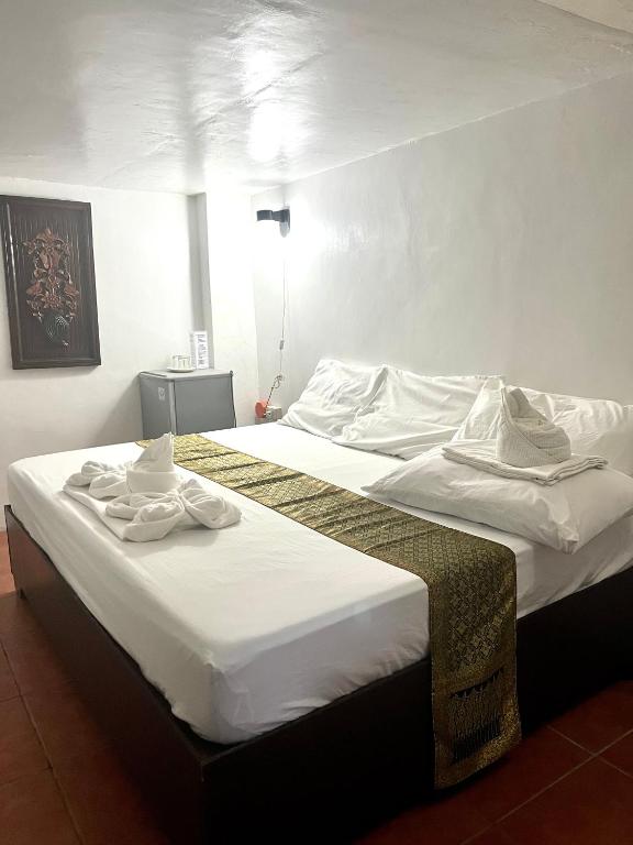 Postel nebo postele na pokoji v ubytování Boracay Ocean Bay Hotel