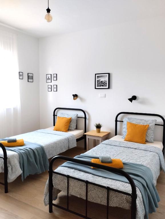 Łóżko lub łóżka w pokoju w obiekcie Apartment Ivetka