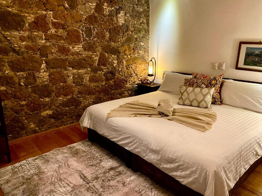 Postel nebo postele na pokoji v ubytování HOTEL MINA REAL