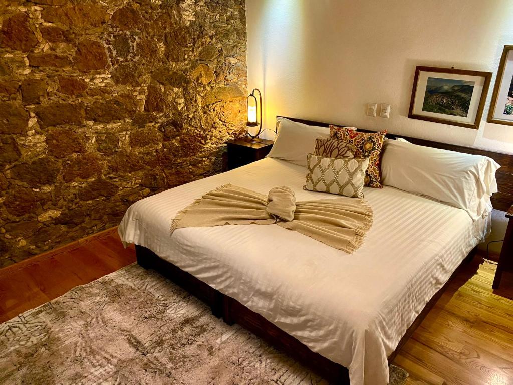 Postel nebo postele na pokoji v ubytování HOTEL MINA REAL