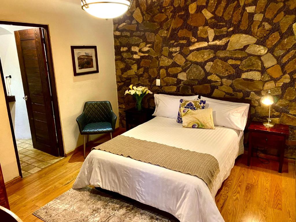 Postel nebo postele na pokoji v ubytování HOTEL MINA REAL