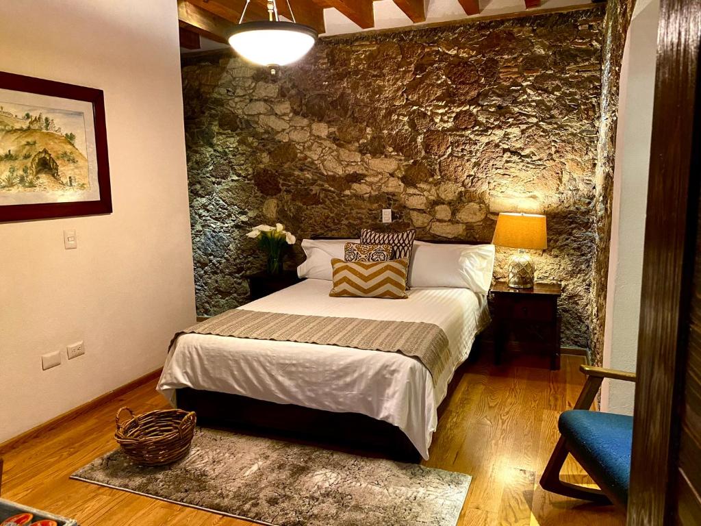 Postel nebo postele na pokoji v ubytování HOTEL MINA REAL