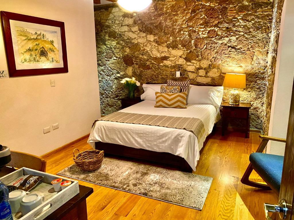 Postel nebo postele na pokoji v ubytování HOTEL MINA REAL