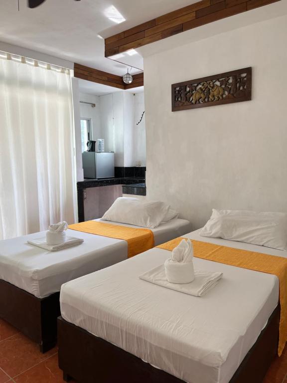 Postel nebo postele na pokoji v ubytování Boracay Ocean Bay Hotel