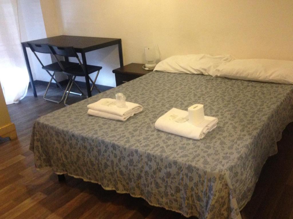 Postel nebo postele na pokoji v ubytování Radio Hotel