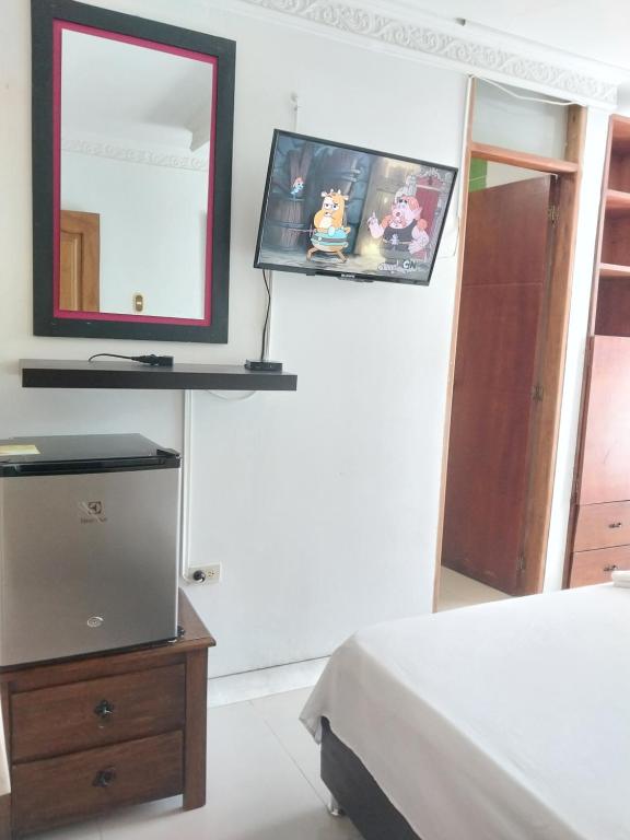 Postel nebo postele na pokoji v ubytování Hotel Sierra Nevada B&B SAS