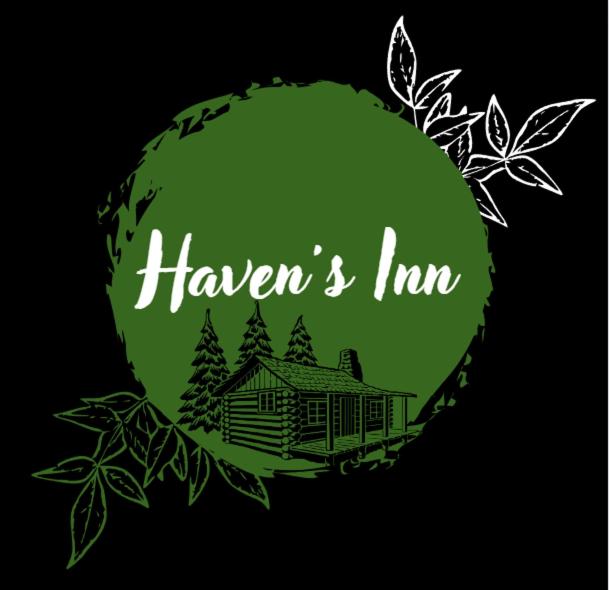 a green circle with a house and trees at Haven´s Inn in Baños