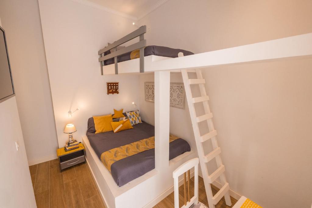 Postel nebo postele na pokoji v ubytování Encanto Townhouse Sliema