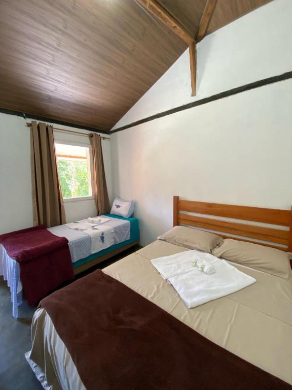 Giường trong phòng chung tại Hospedagem Vilella da Serra