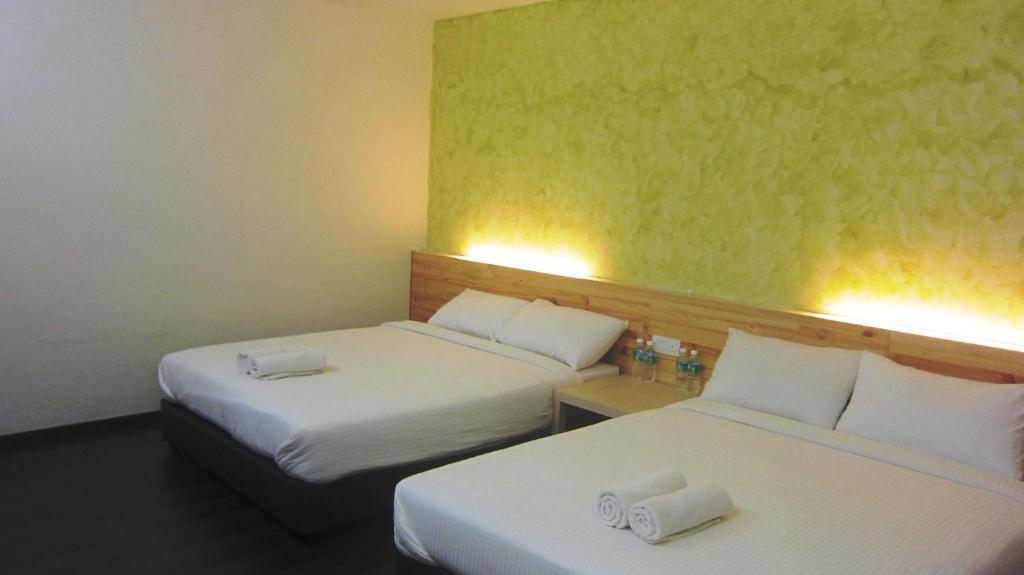 Postel nebo postele na pokoji v ubytování Dream Garden Hotel